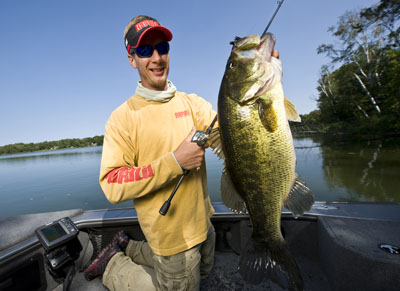 A rising star in bass angling, Troy Lindner displays the results of his radical swim jig pattern.