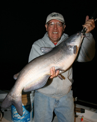 Captain Ormseth, posing with a blue cat caught on one of his special chum rigs. Photo courtesy of Rippin Lips